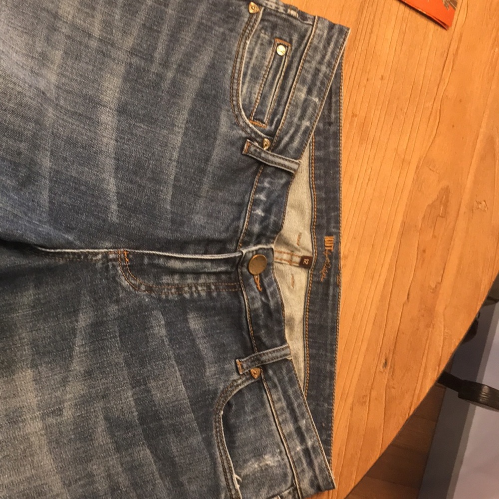 Boyfriend Jeans. Lightly distressed. 99% Cotton, 1% Spandex. Substantial weight.